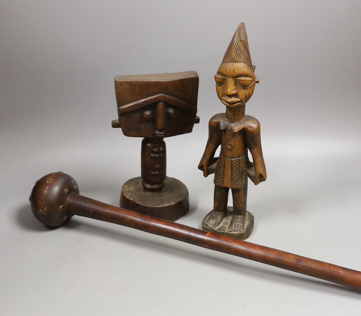 A Zulu knobkerrie, an Ibeji wood figure and a Gabon Fanti fertility figure- Knobkerrie 73 cms long.